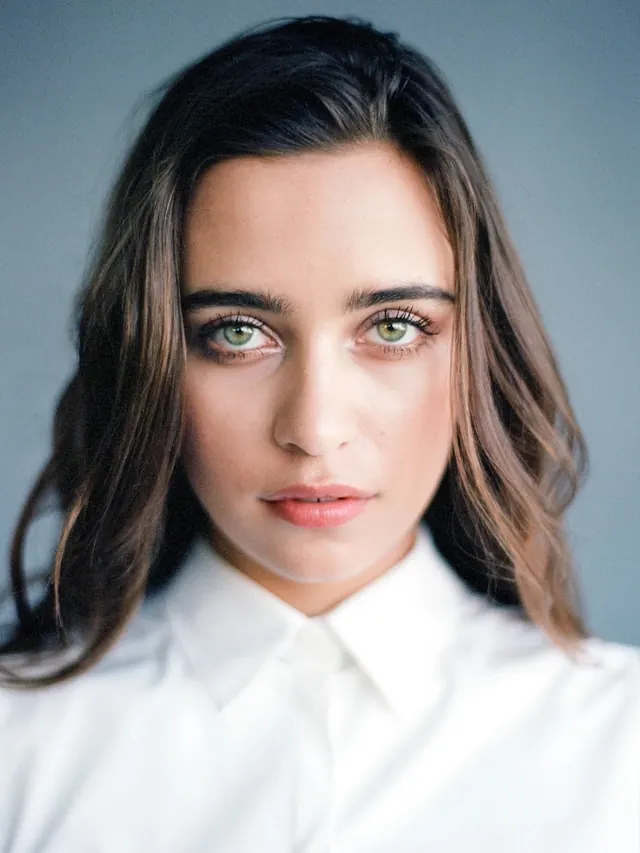 Portrait of a woman in white shirt, minimal, photographic, light