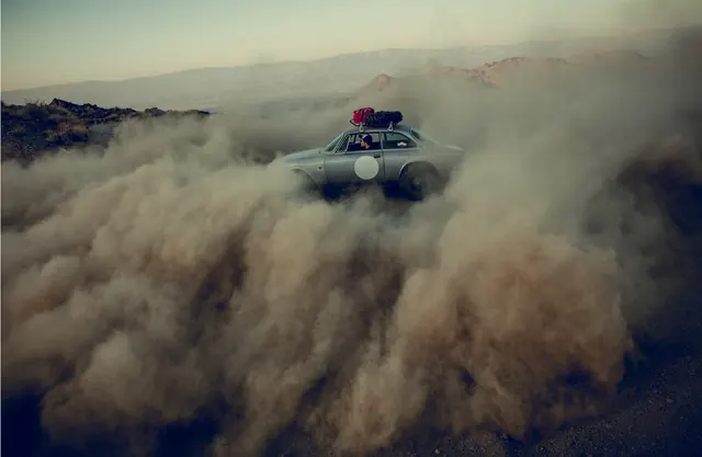 Vintage car in desert dust storm, 3d-render, surreal, warm