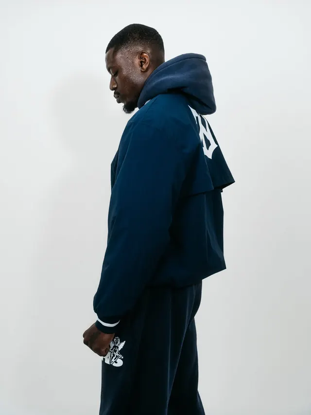 Navy hoodie product shot with side-angle profile, minimal, flat, dark
