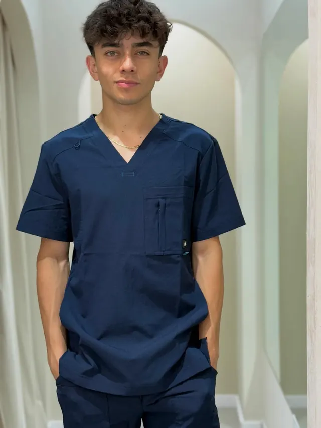 Navy scrubs portrait headshot, photographic, minimal, high-contrast