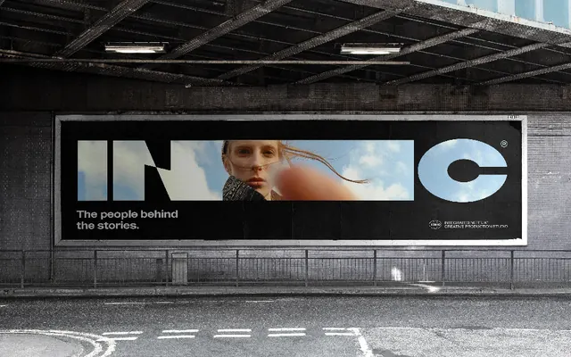 Large-format billboard mockup in concrete garage setting, photographic, minimal, monochrome