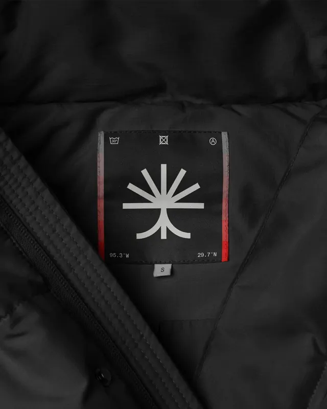 Technical apparel label with compass logo, minimal, technical, dark