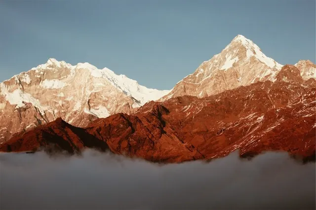 Mountain landscape with dramatic color separation, photographic, warm