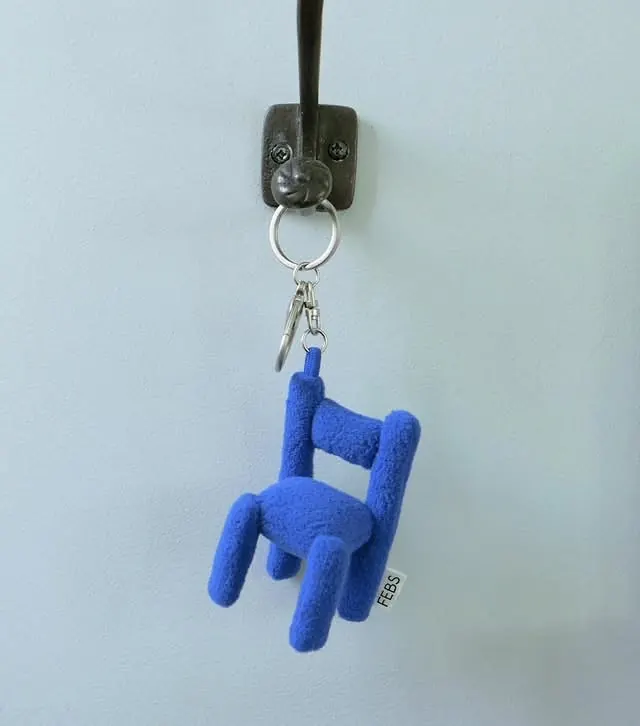 Blue sculptural fabric chair keychain, playful, organic, cool