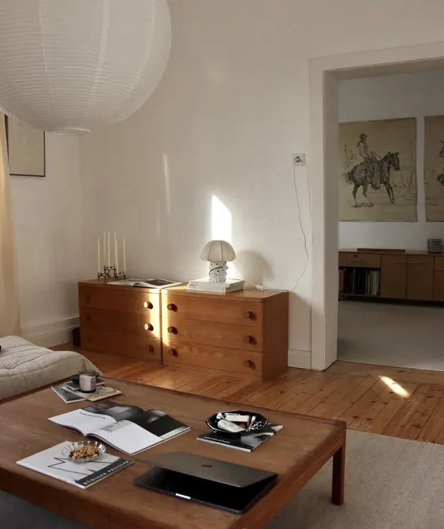 Japandi bedroom with warm wood and soft pendant lighting, minimal, organic, warm