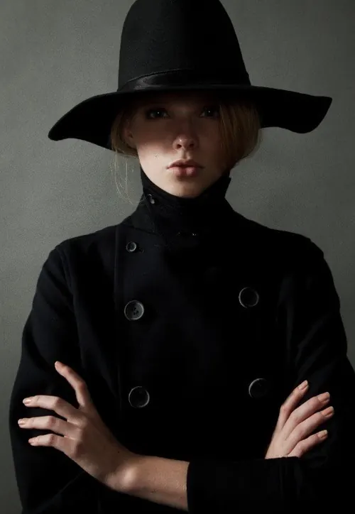 Portrait of a woman in a black hat, monochrome, minimal, monochrome