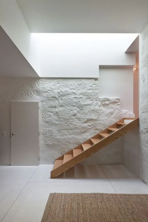 Minimalist Interior with Stone Wall and Wooden Stairs, minimal, organic, light