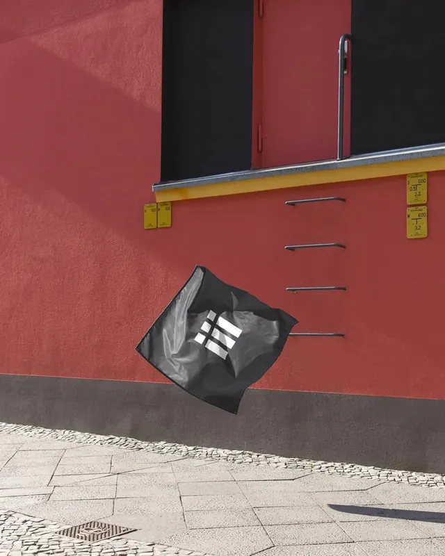 Street Art Mural on Red Building, brutalist, high-contrast