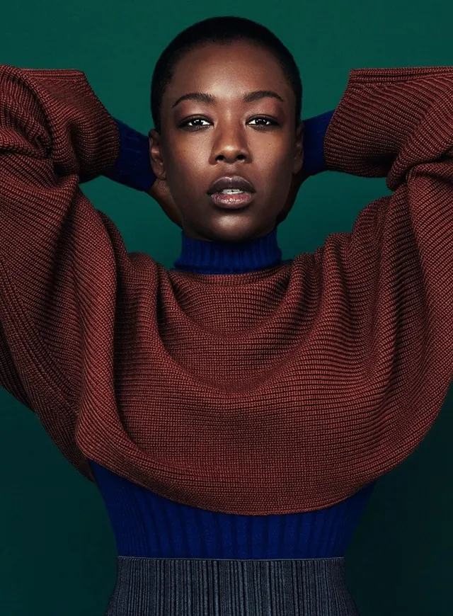 Portrait of a woman in textured knitwear, editorial, photographic, vibrant