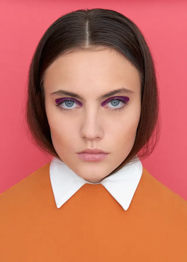 Portrait of a woman in orange and pink, minimal, flat, vibrant