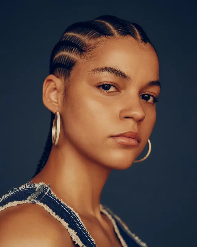 Portrait of a Woman with Braided Hair, photographic, minimal, warm