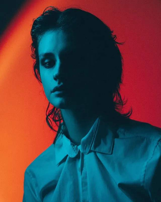 High-Contrast Portrait with Dual Lighting, photographic, vibrant