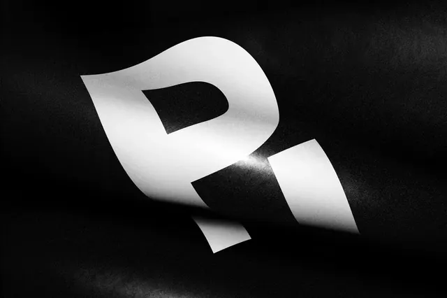 Distorted letter R on folded surface, minimal, typographic, monochrome