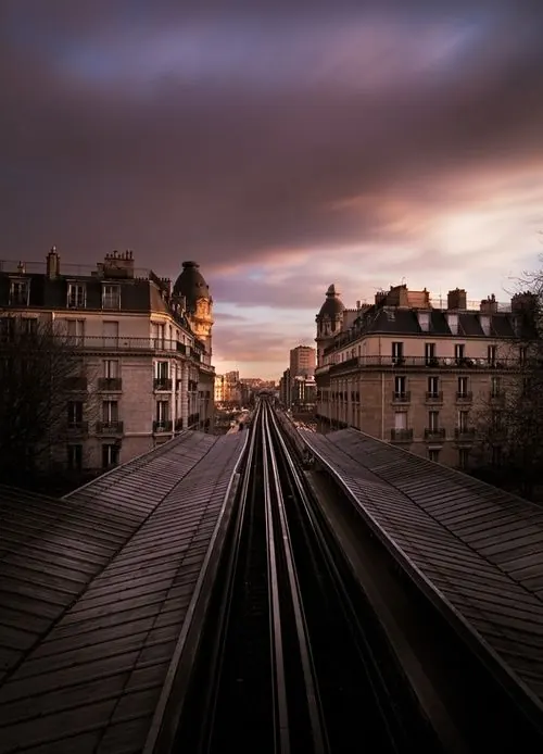 Urban Train Tracks at Dusk, photographic, minimal, warm
