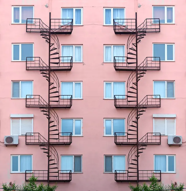 Pink Building with External Fire Escapes, minimal, geometric, vibrant