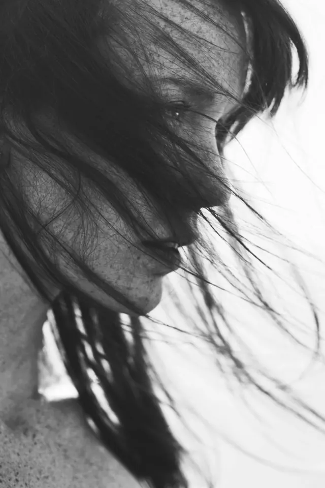Monochrome portrait with hair and movement, photographic, monochrome