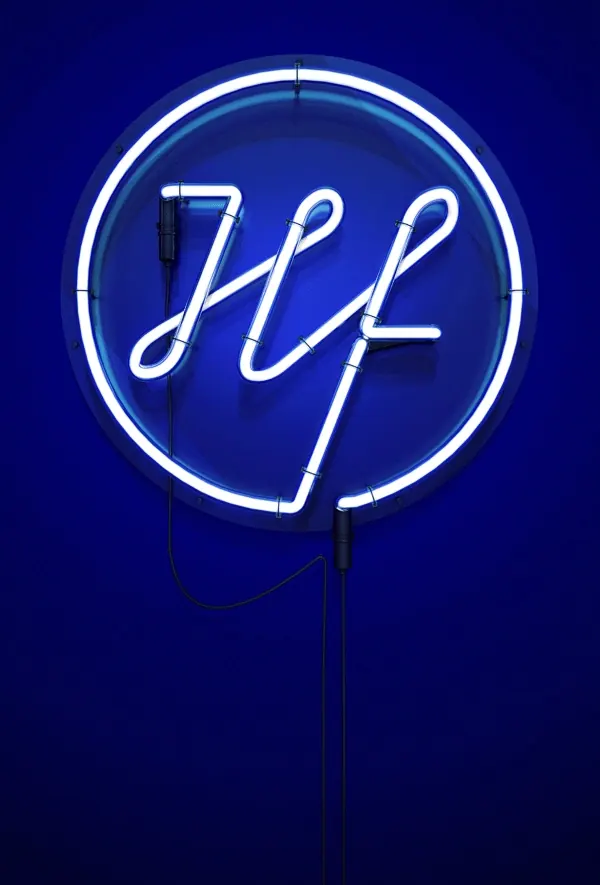 White neon script in circular ring on dark blue, technical, neon, dark