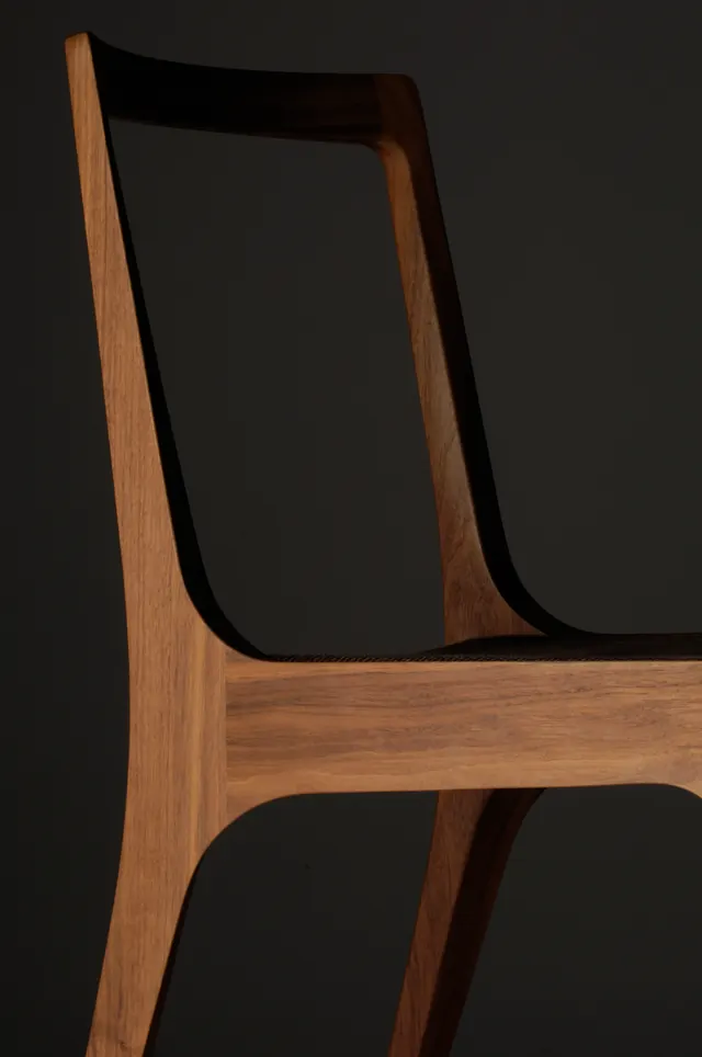Sculptural wooden chair, minimal, organic, dark