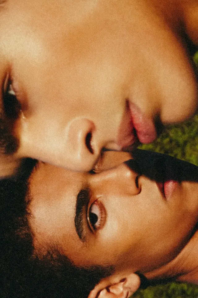 Intimate embrace portrait with warm tones, photographic, editorial, warm