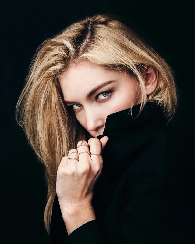 Portrait of a woman in black attire, minimal, photographic, dark