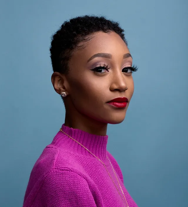 Portrait of a woman in pink knitwear, photographic, vibrant