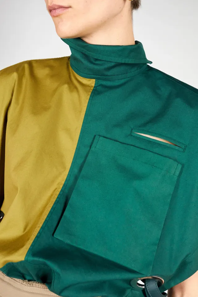 Green and Gold High-Neck Garment, minimal, photographic, vibrant