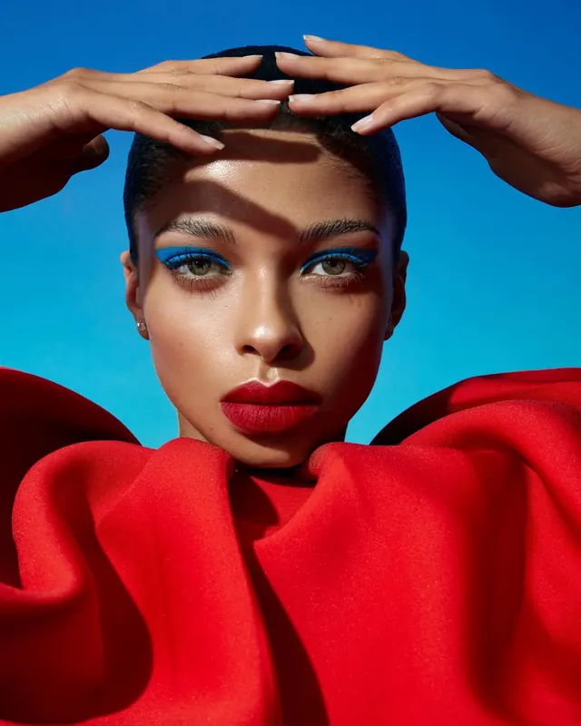 Portrait with Red Fabric and Blue Accents, editorial, vibrant