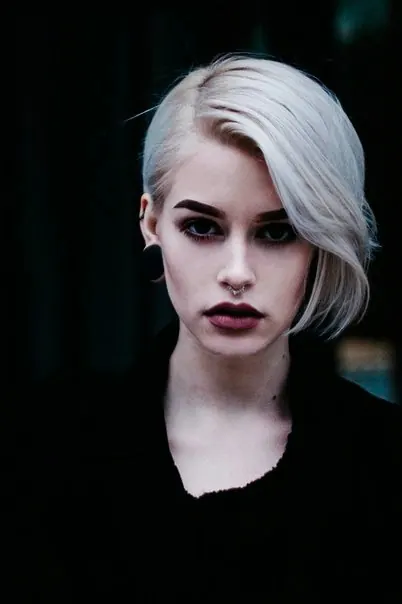 Portrait of a Woman with Platinum Blonde Hair, dark-mode, photographic, dark