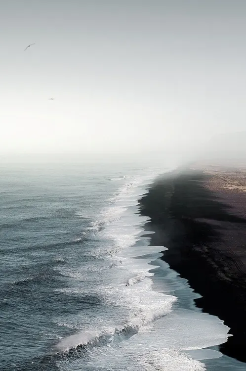 Dramatic coastal black sand landscape, photographic, landscape, cool