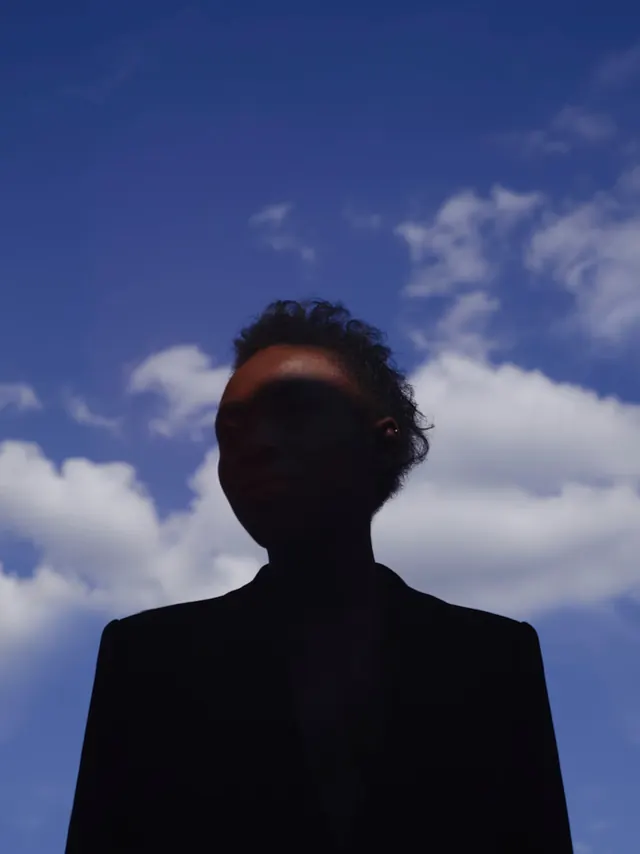 Silhouetted Figure Against Sky, photographic, minimal, cool