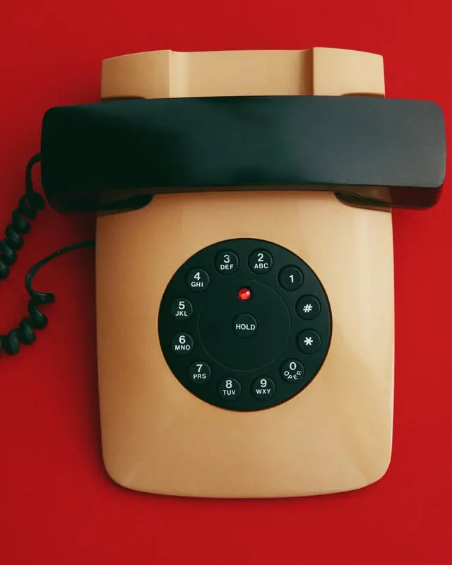 Vintage rotary telephone product shot, retro, photographic, vibrant