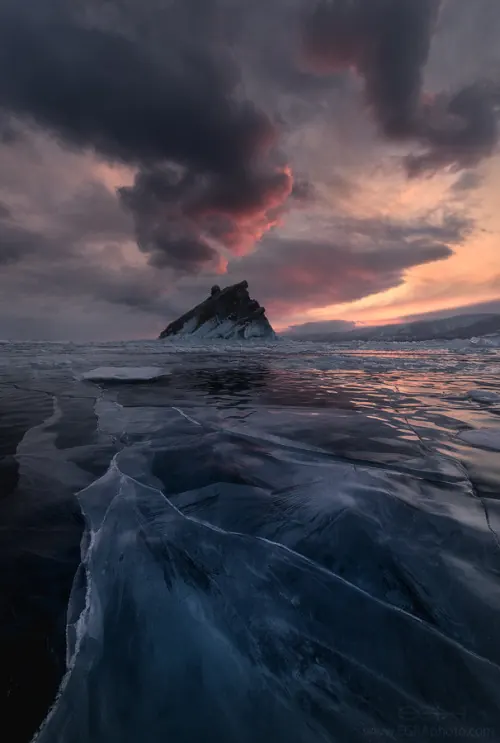 Dramatic coastal landscape at sunset, photographic, warm