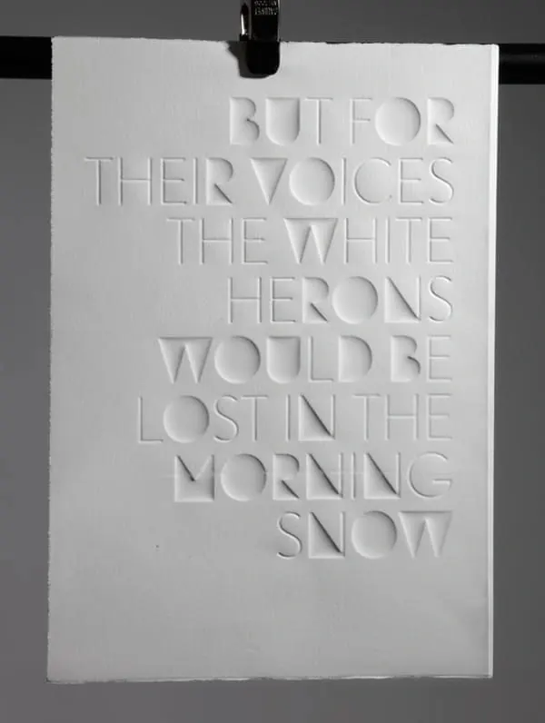 Embossed poetry on white card, minimalist, editorial, monochrome