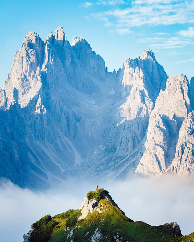 Alpine mountain landscape with lone figure, photographic, cool
