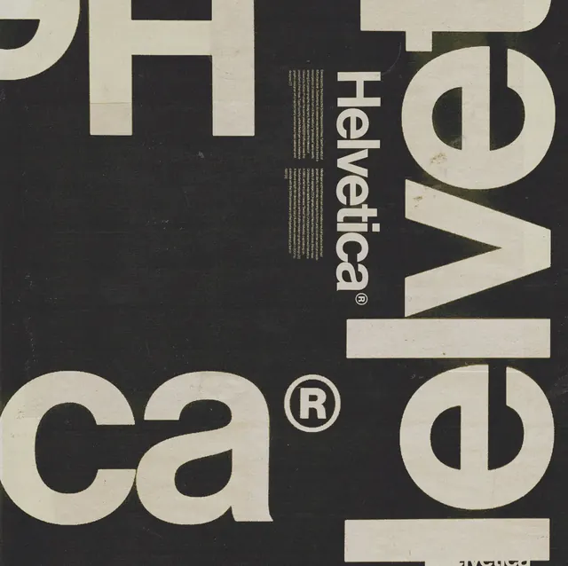 Close-up Helvetica typography specimen on black, minimal, swiss, monochrome