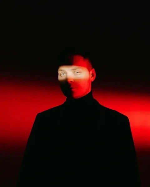 Portrait with red geometric light effect, photographic, dark