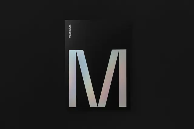 Magnesium identity branding with gradient letter forms, minimal, dark-mode, dark