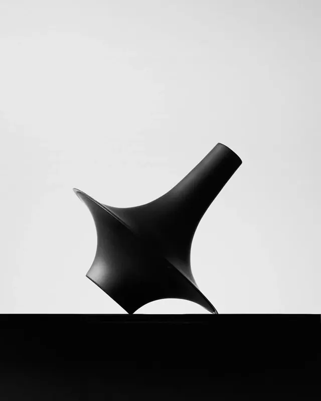 Curved black sculptural form on light background, minimal, 3d-render, monochrome