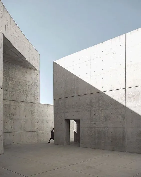 Brutalist concrete courtyard with hard shadow, architectural, minimal, neutral