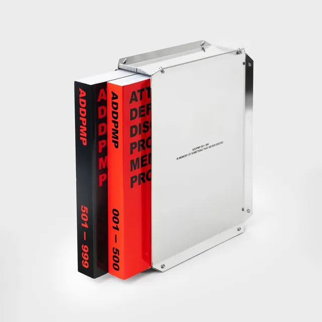 Design system book stack with bold typography and dual-tone binding, editorial, bold, high-contrast