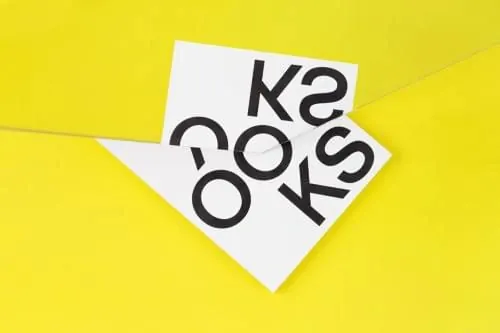 K2 O.S typographic design on paper, minimal, geometric, vibrant