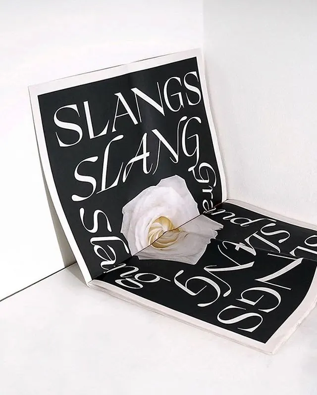 Black card with white flowing script lettering, minimal, illustrated, high-contrast