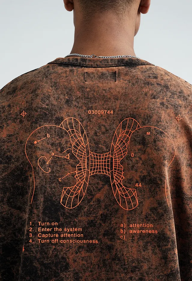 Distressed t-shirt with orange technical line-art diagram and instructions, minimal, technical, earthy