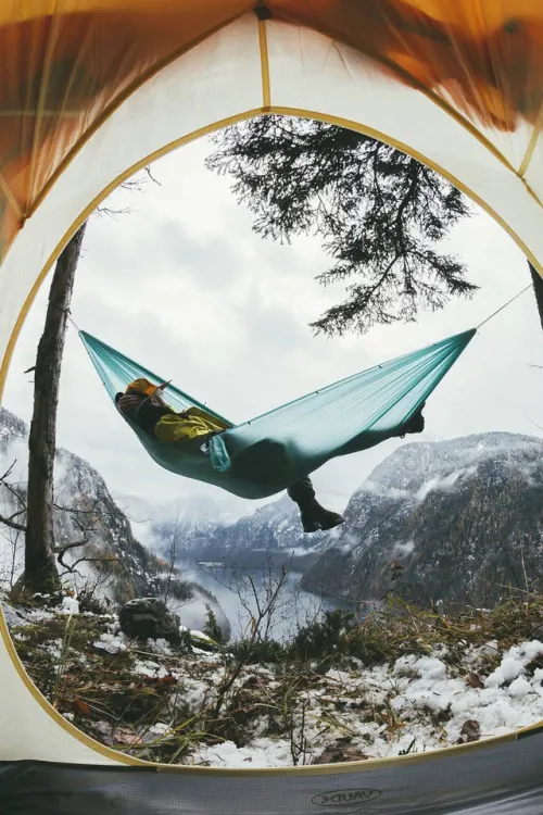 Hammock camping view over snowy mountain valley, photographic, minimal, cool