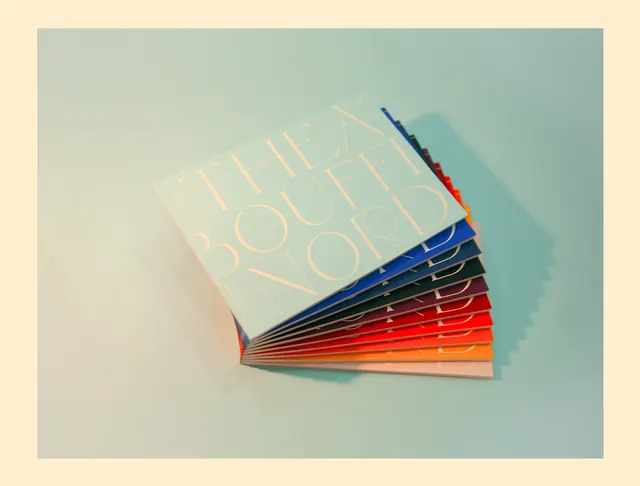 Fanned book design mockup with typography, minimalist, editorial, pastel