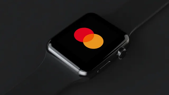 Mastercard logo on smartwatch display, technical, minimal, dark