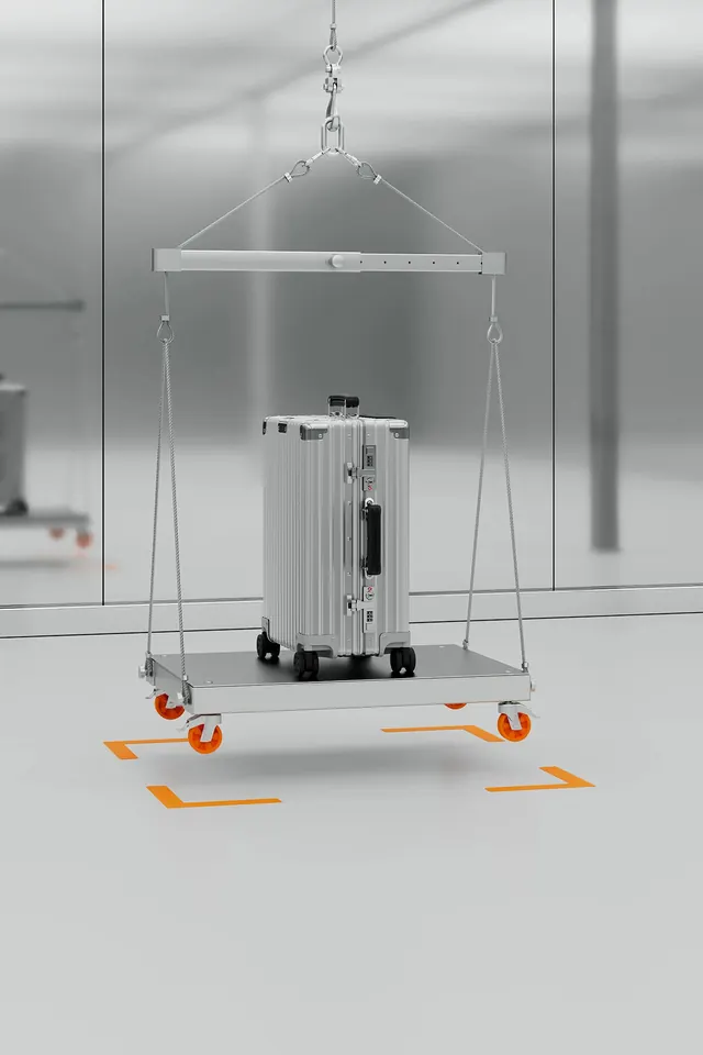 Suspended Rimowa luggage rig, minimal, technical, light