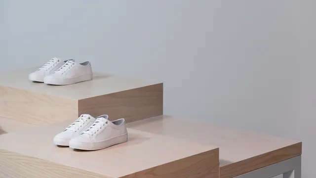 White Sneakers on Wooden Pedestals