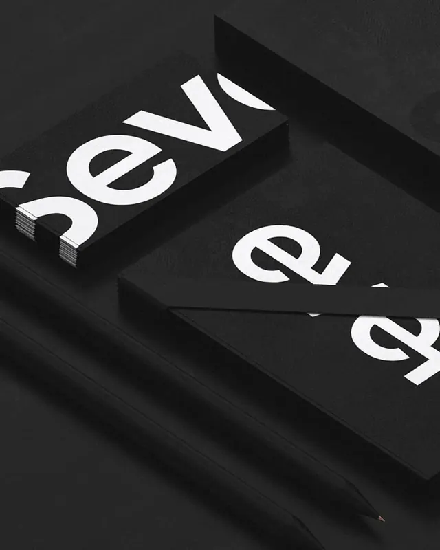 Minimal black stationery with white cut-off typography, minimal, monochrome, dark