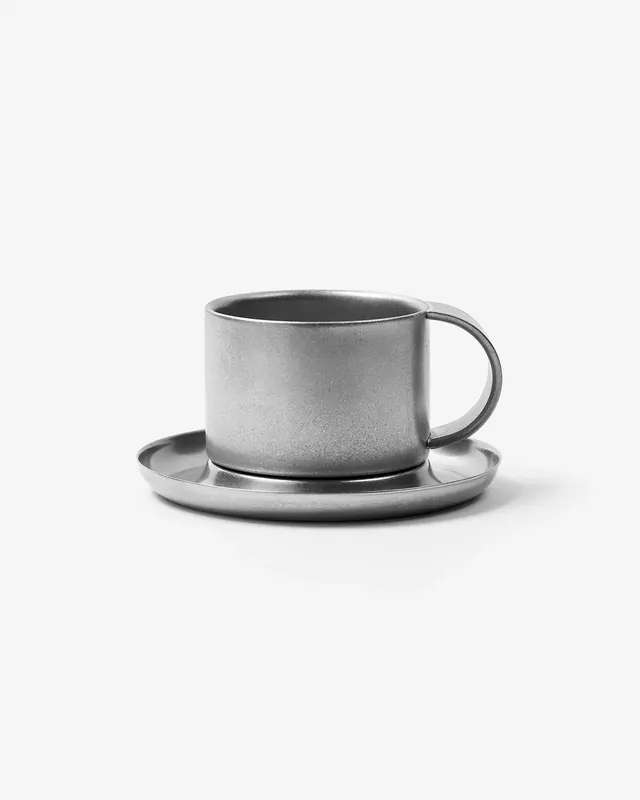 Minimalist stainless steel coffee cup product showcase, minimal, photographic, monochrome